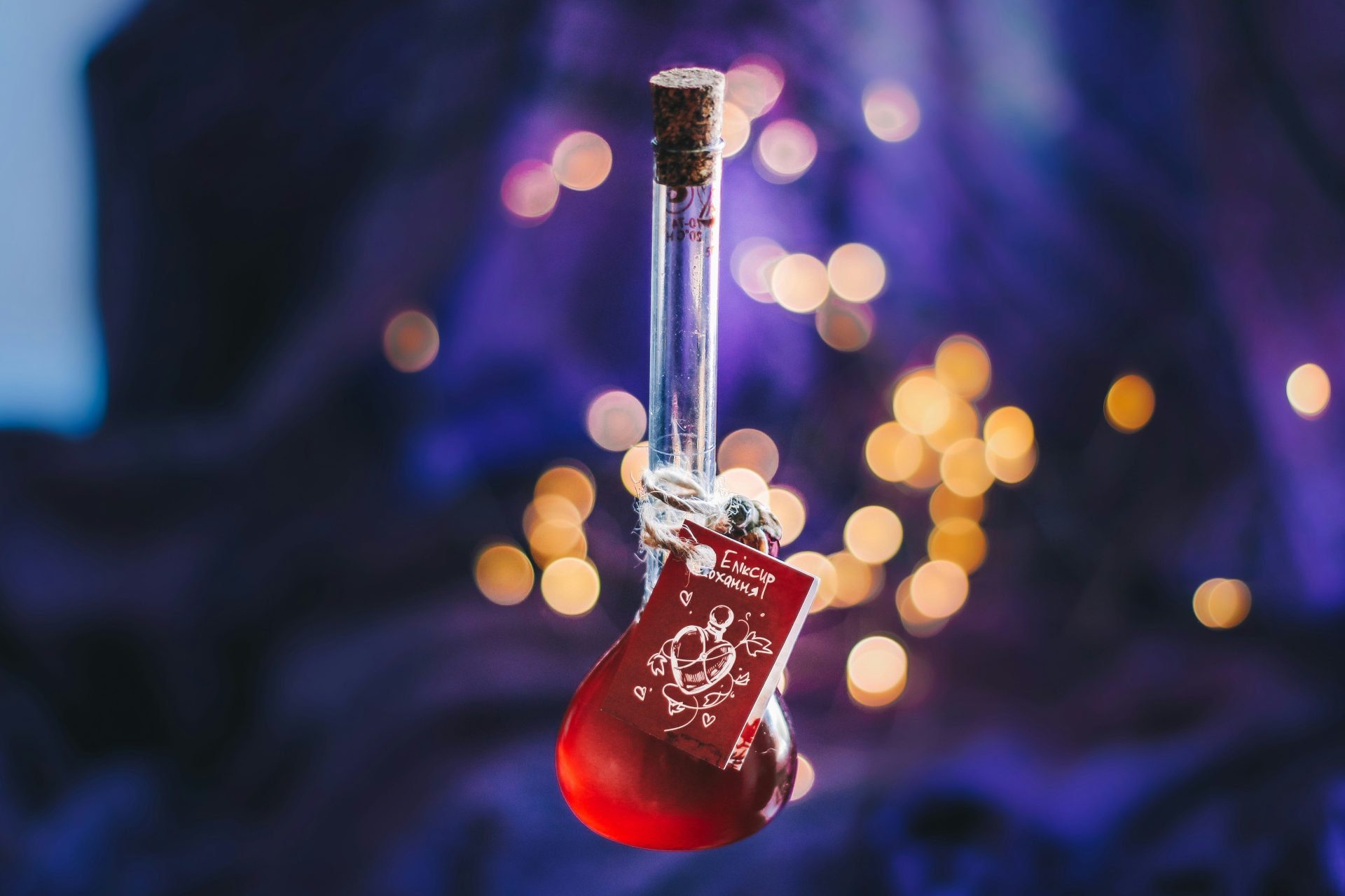 A red potion vial hangs with a decorative tag.